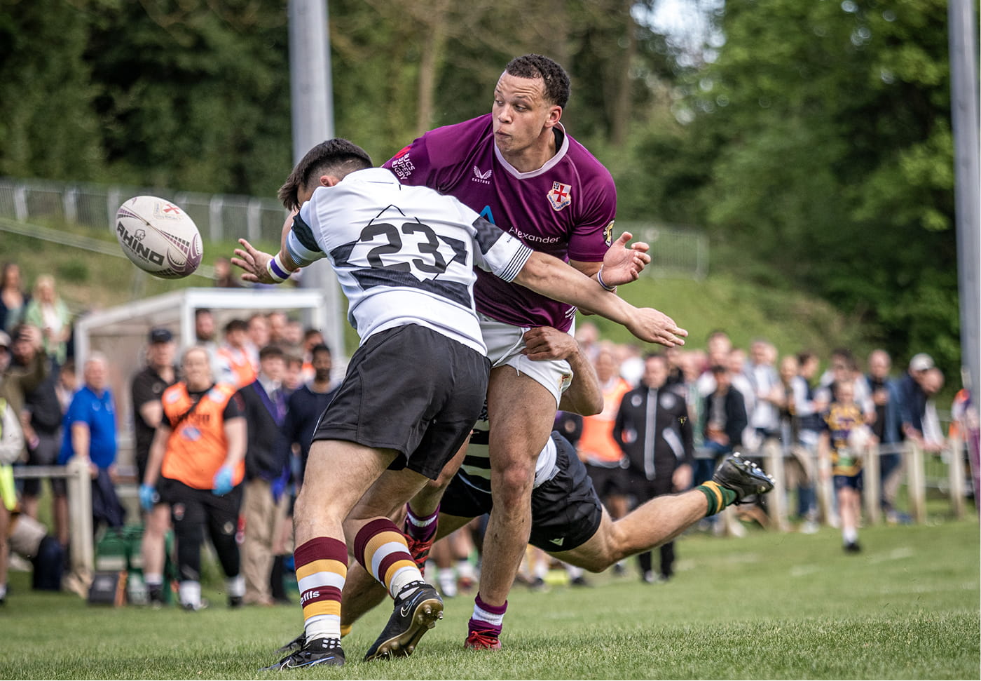 Mitchell Lacey Babalola being tackled by alumnus Pat Bishop