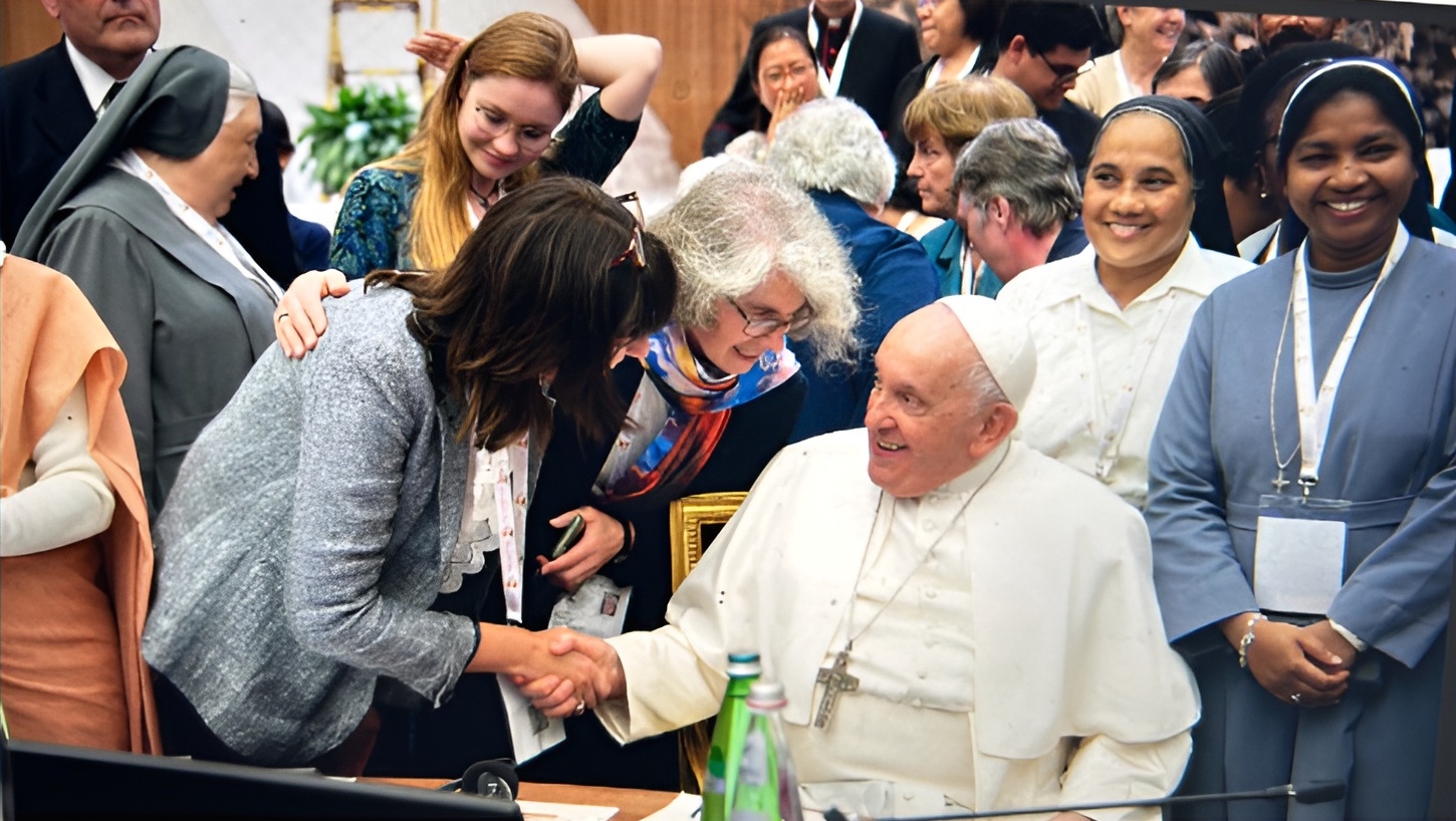 Professor Anna Rowland, shaking hands with the late Pope Francis